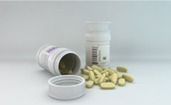 3d model of a medicine bottle and pills.